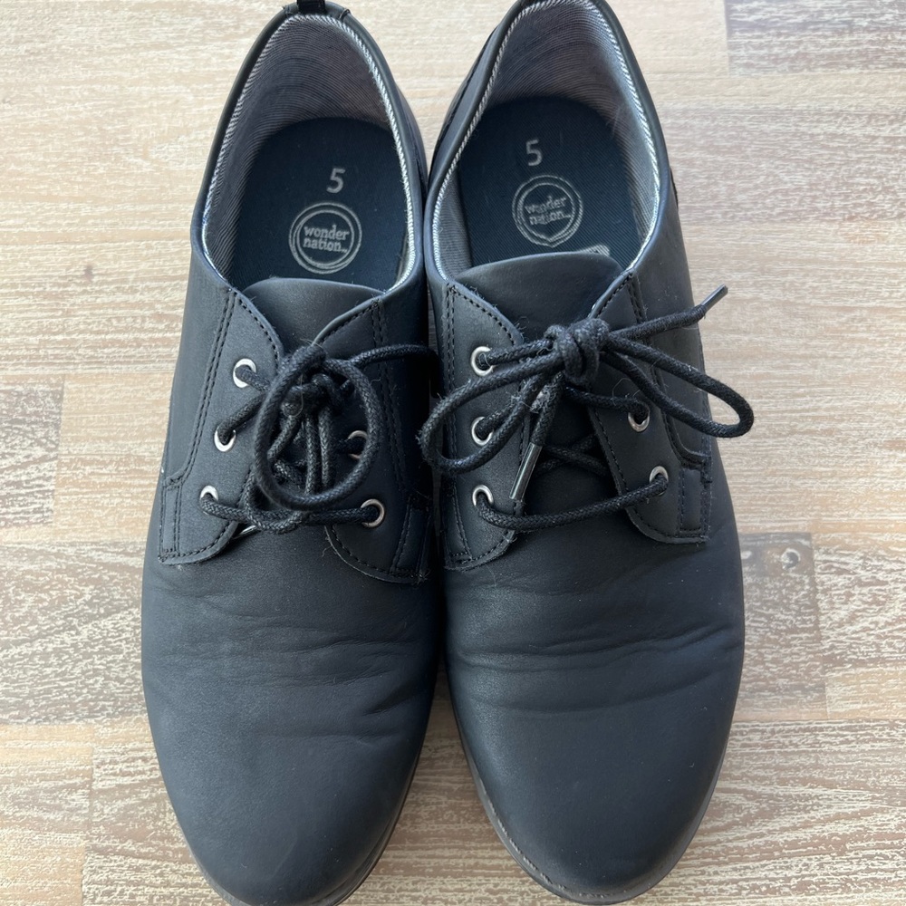 Youth casual dress shoe. Color is a black but almost looks blue. Wore twice.